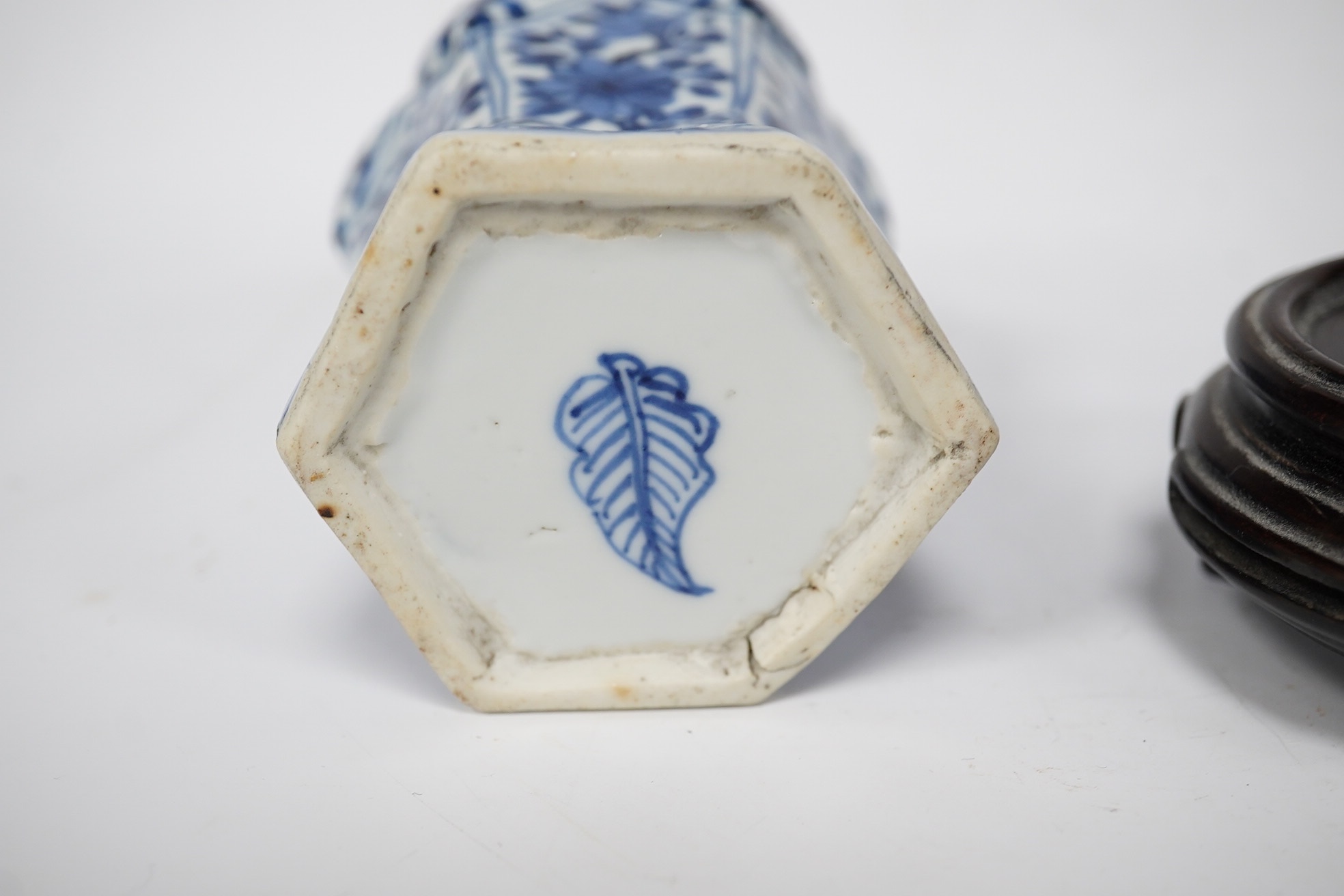 A Chinese blue and white hexagonal jar, Kangxi period and stand, 10cm high. Condition -small firing crack to inside edge of foot, otherwise good